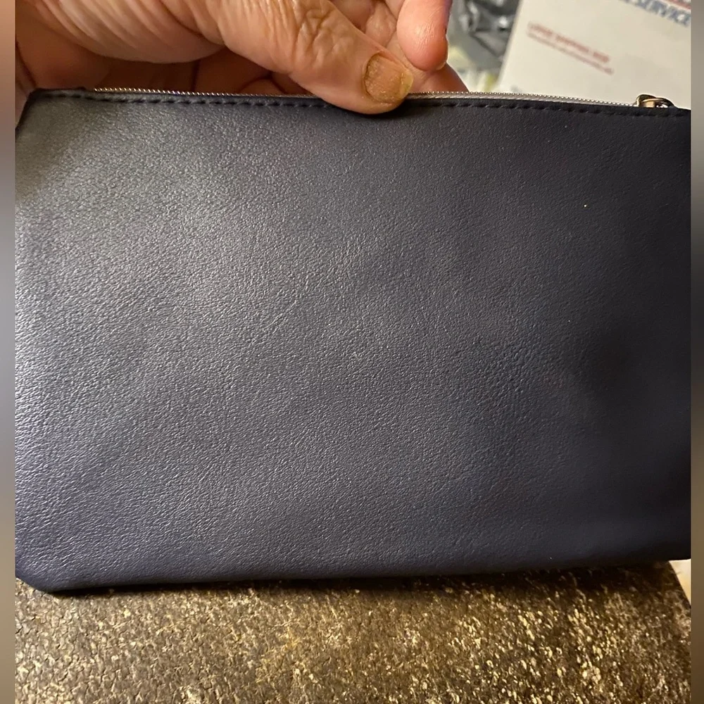 IPSY pouch with orange logo ribbon